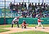 Niños jugando beisbol en los terrenos de la Ciudad Deportiva